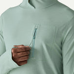 Patagonia men's light green hooded sun shirt with chest pocket zipper detail