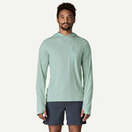 Man wearing sage green Patagonia hooded sun shirt with chest pocket