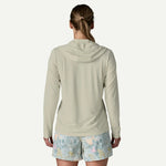Back view of woman wearing Patagonia hooded long-sleeve shirt in sage green
