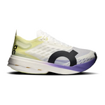 On Cloudboom Strike running shoe in white with lime green accents