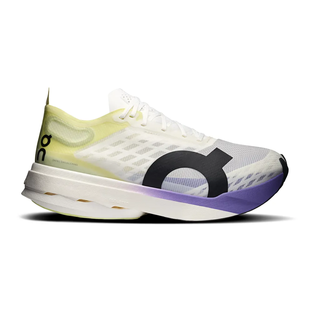 On Cloudboom Strike running shoe in white with lime green accents