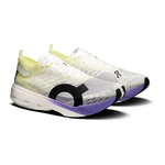 On Cloudboom Strike running shoes in white with lime green and purple accents