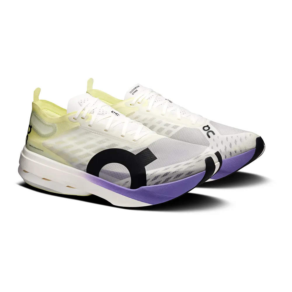 On Cloudboom Strike running shoes in white with lime green and purple accents