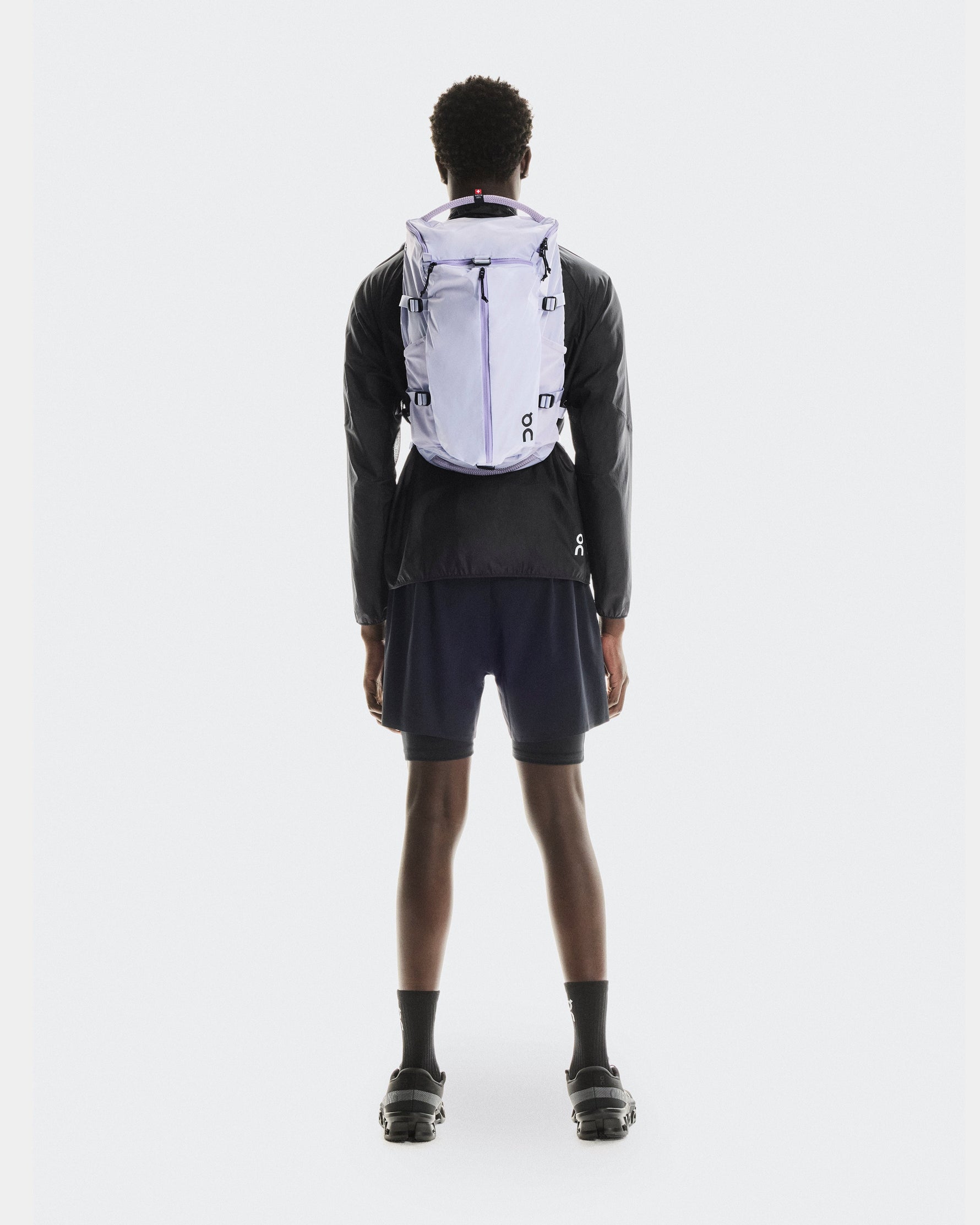 On Speed Pack 18L LiteMagnet backpack in thistle purple worn by model