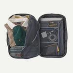 Patagonia Black Hole MLC travel bag opened showing organized compartments with clothing and accessories