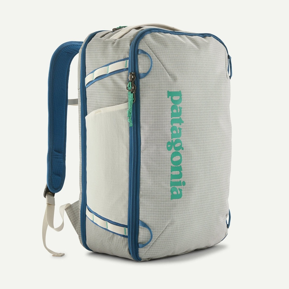 Patagonia Black Hole Mini MLC backpack in Birch White with blue trim and green logo