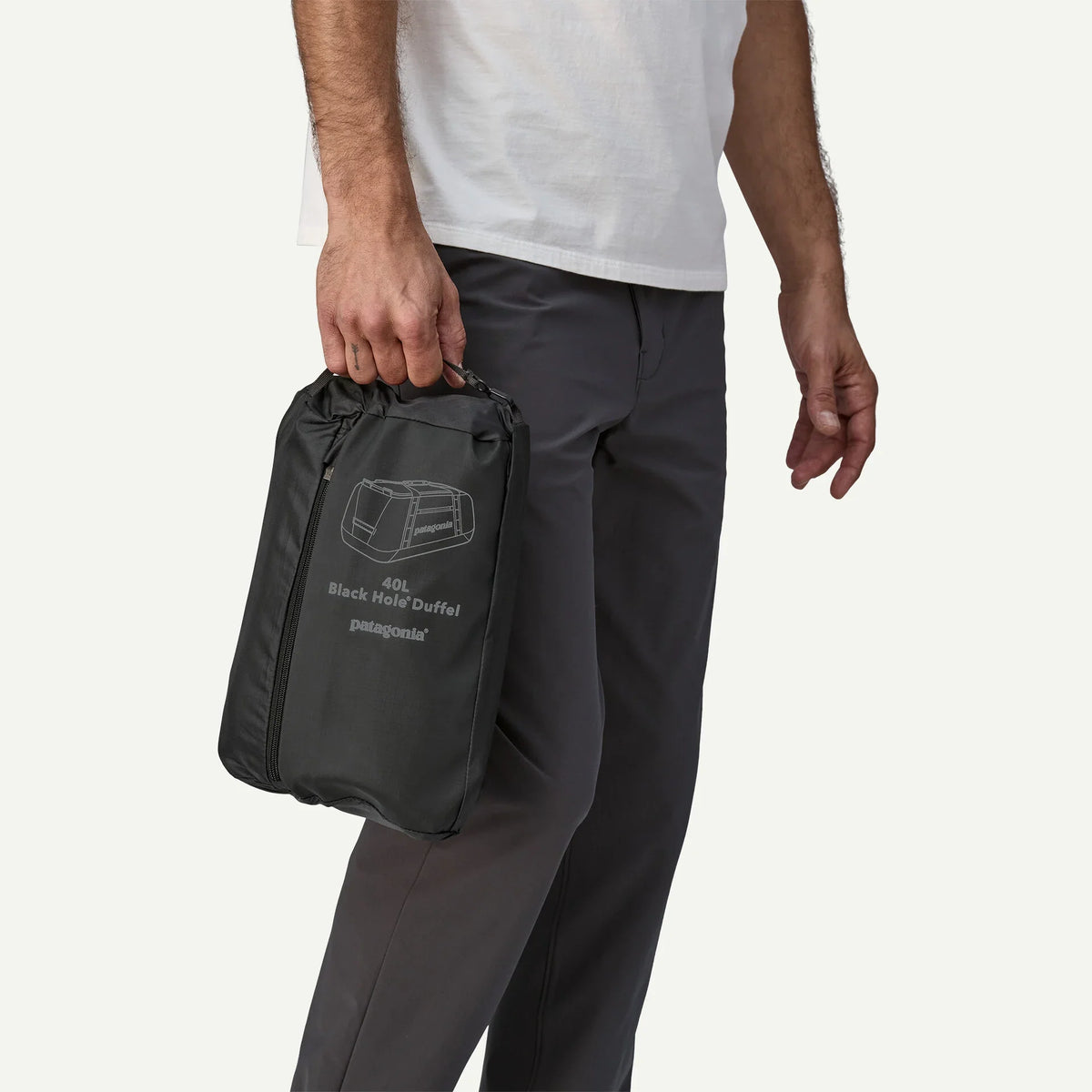 Patagonia Black Hole 40L Duffel packed into its own stuff sack in black