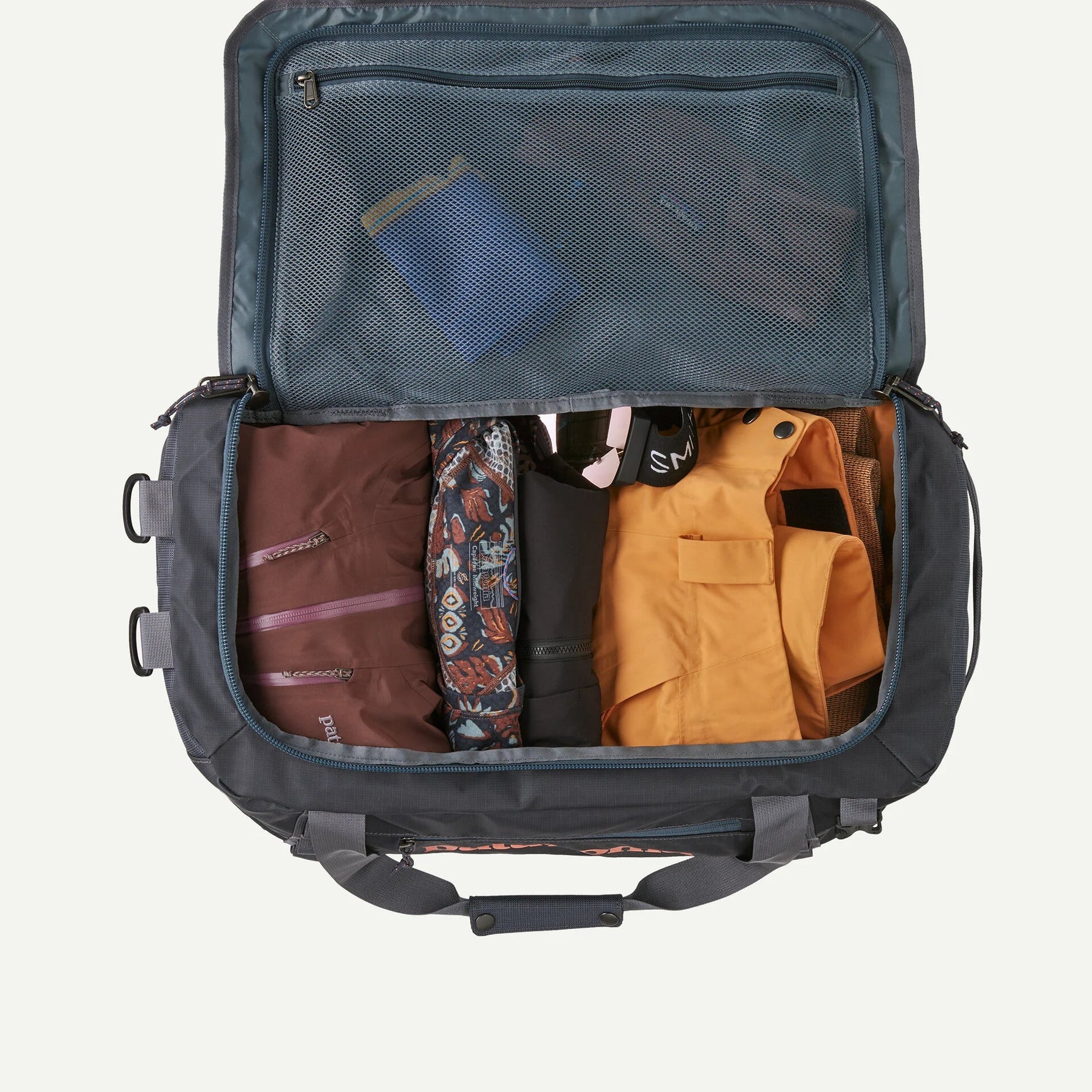 Patagonia Black Hole Duffel 40L open showing packed interior with packing cubes and gear