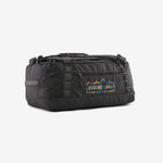 Patagonia Black Hole duffel bag in black with rainbow logo on clean white background