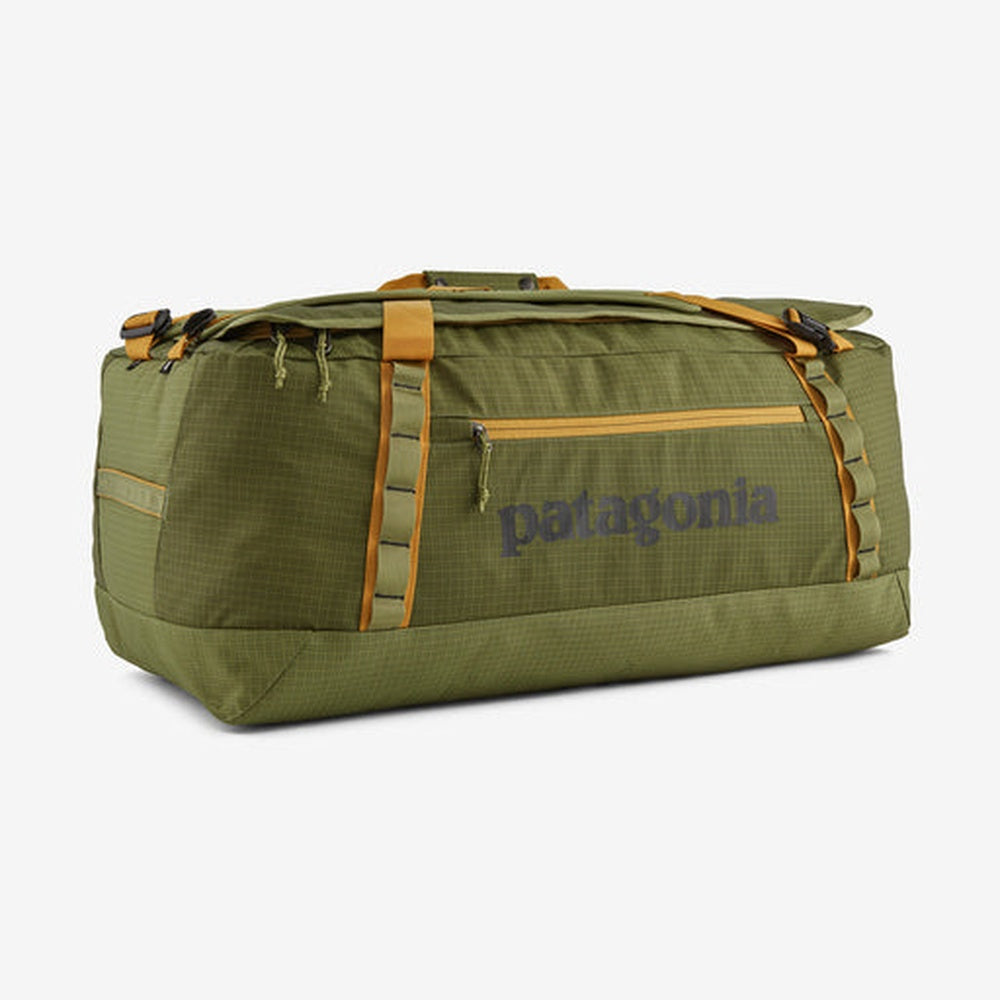 Patagonia Black Hole Duffel 70L in olive green with orange trim and handles
