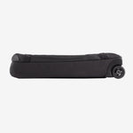 Black Patagonia Black Hole wheeled duffel bag lying flat on white background