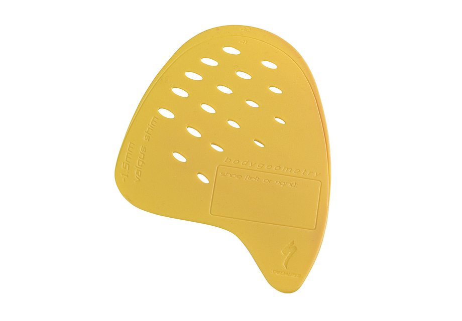 Specialized Body Geometry yellow-orange internal wedge with perforated holes and curved design