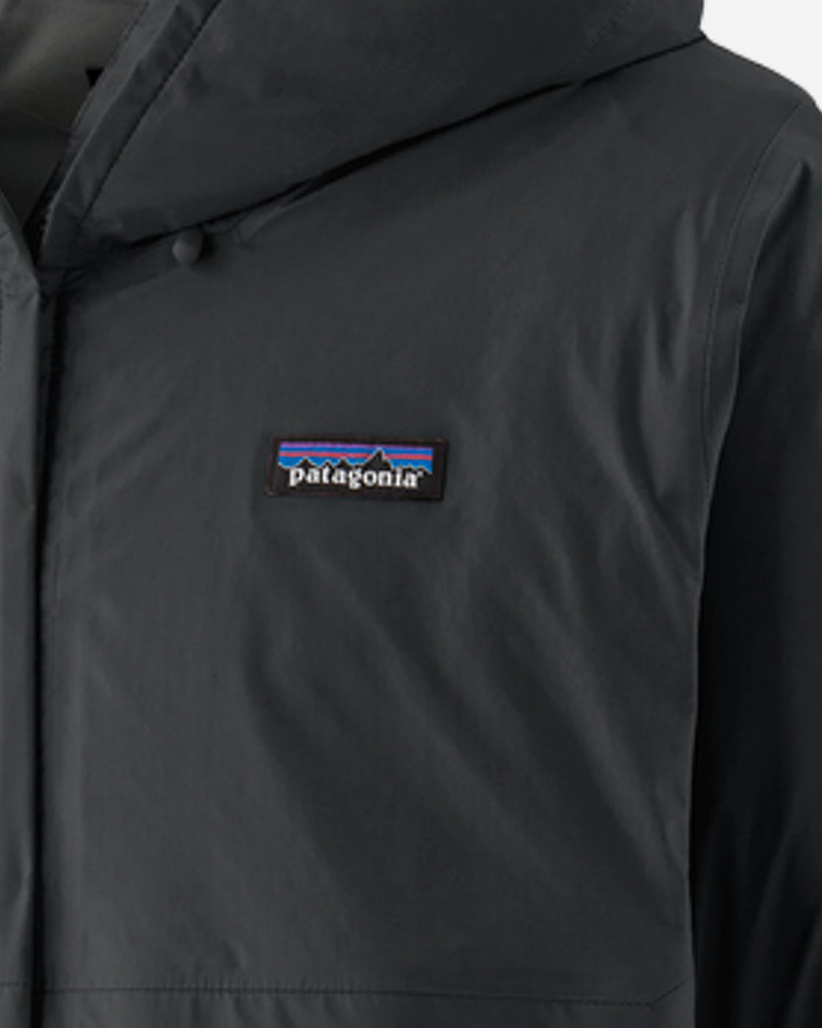 Close-up detail of Patagonia logo patch on black Torrentshell 3L Jacket chest