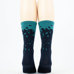 Taba Legg T Cycling Socks in navy blue with turquoise splatter pattern and teal cuff
