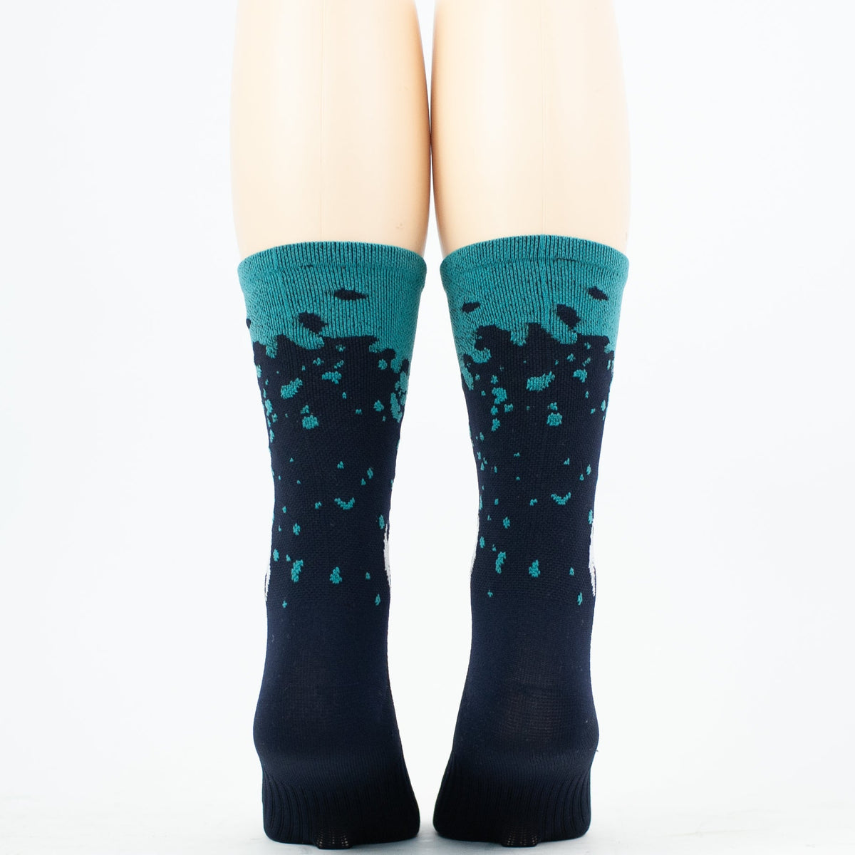 Taba Legg T Cycling Socks in navy blue with turquoise splatter pattern and teal cuff
