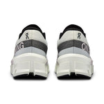On Cloudmonster 2 running shoes in undyed off-white colorway, rear view showing heel design
