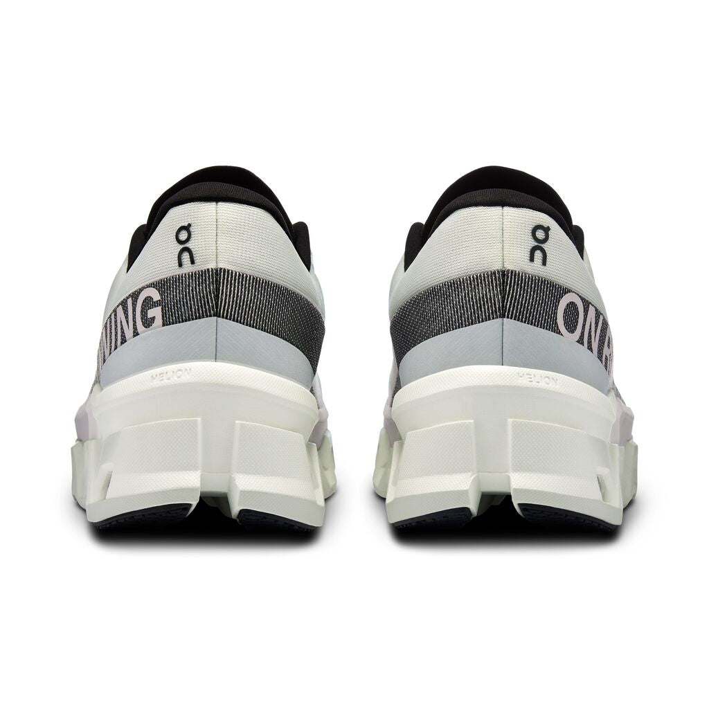 On Cloudmonster 2 running shoes in undyed off-white colorway, rear view showing heel design