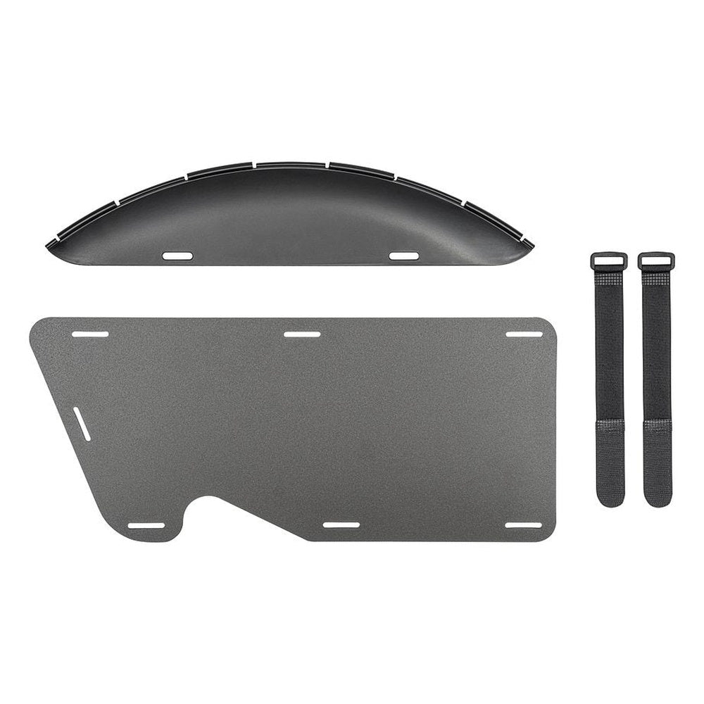 Black bike wheel cover components laid out showing curved cover piece, mounting plate and straps