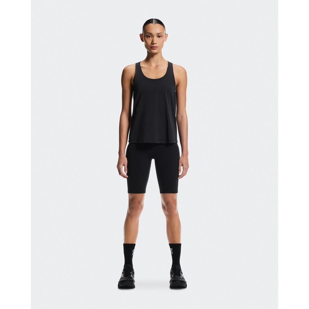 Woman wearing black On Focus Tank top with black shorts and socks
