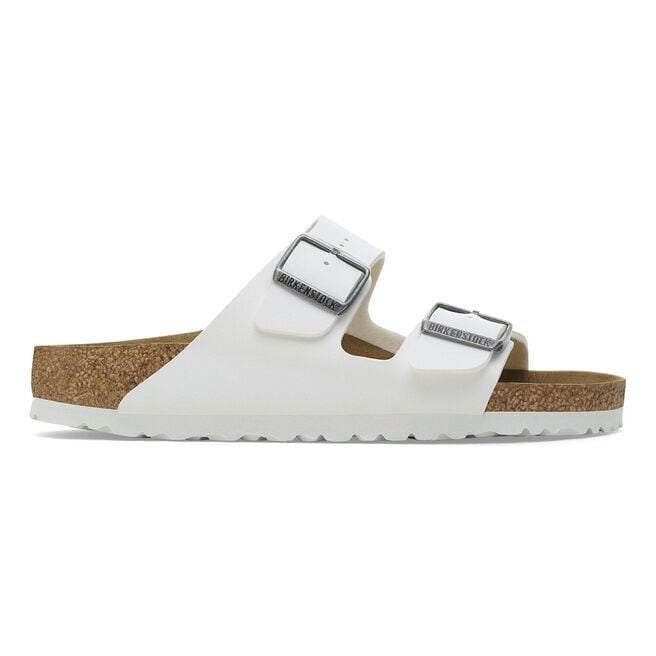 White Birkenstock Arizona two-strap sandals with cork footbed and white sole