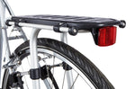 Black Thule Pack N Tour bike rack mounted on bicycle rear wheel