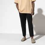 Person wearing Birkenstock Boston clogs in taupe suede with casual outfit