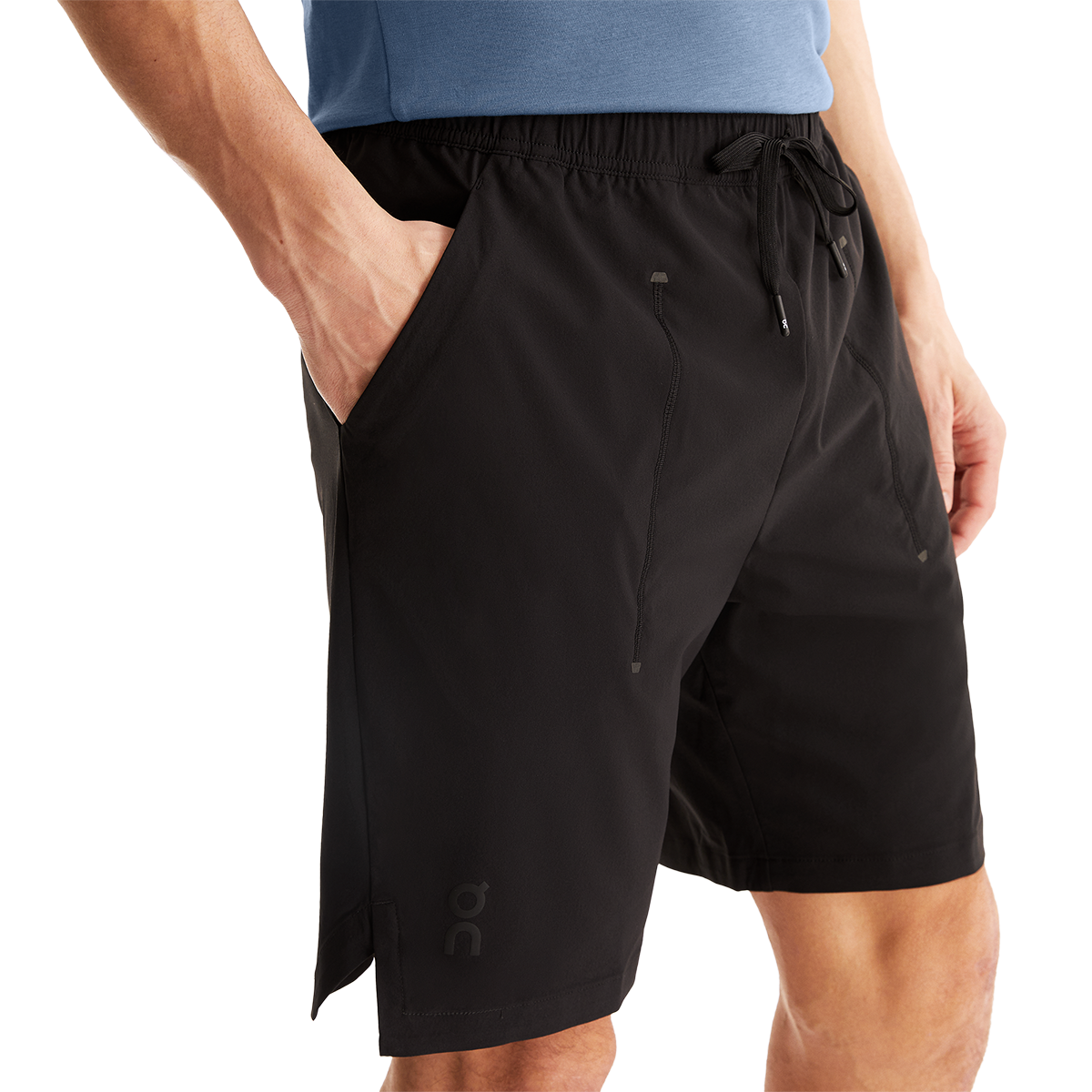 Man wearing black On Focus Shorts with drawstring waist and side pockets