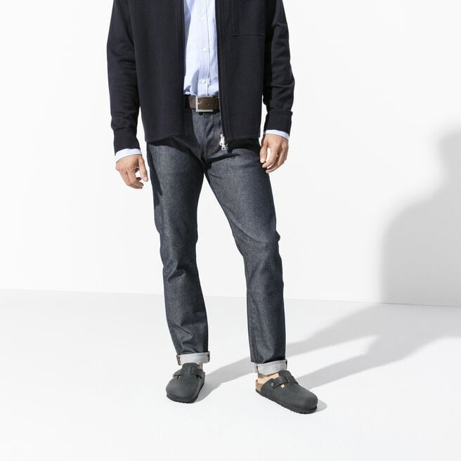 Black Birkenstock Boston clogs worn with jeans in professional studio setting