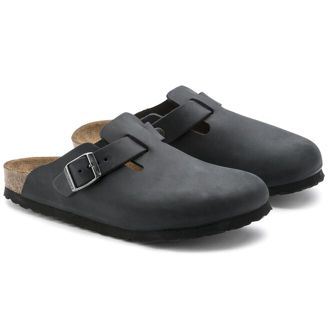 Black Birkenstock Boston oiled leather clogs with adjustable buckle straps