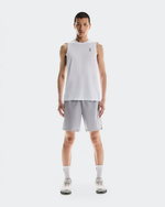 Male model wearing On brand light gray tank top and shorts athletic set
