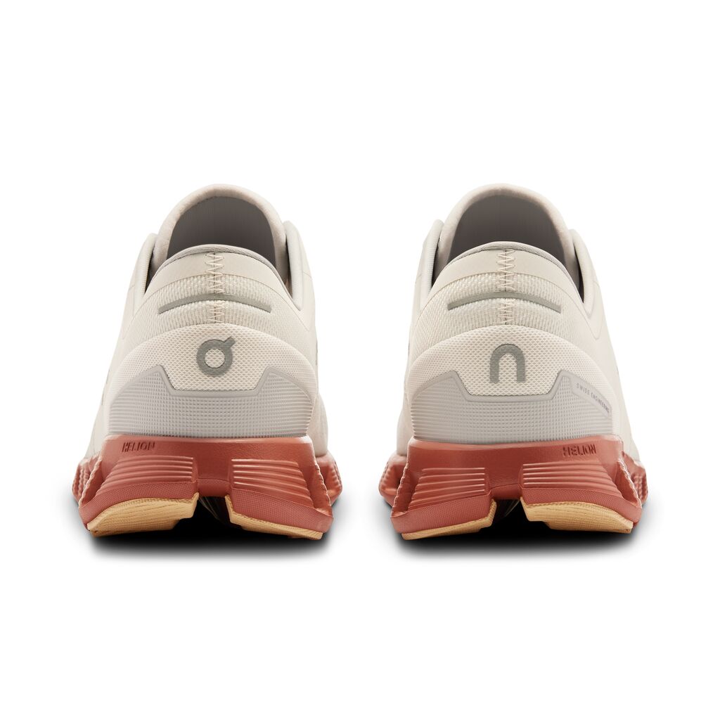 On Cloud X 3 running shoes in ice and auburn colorway, rear view
