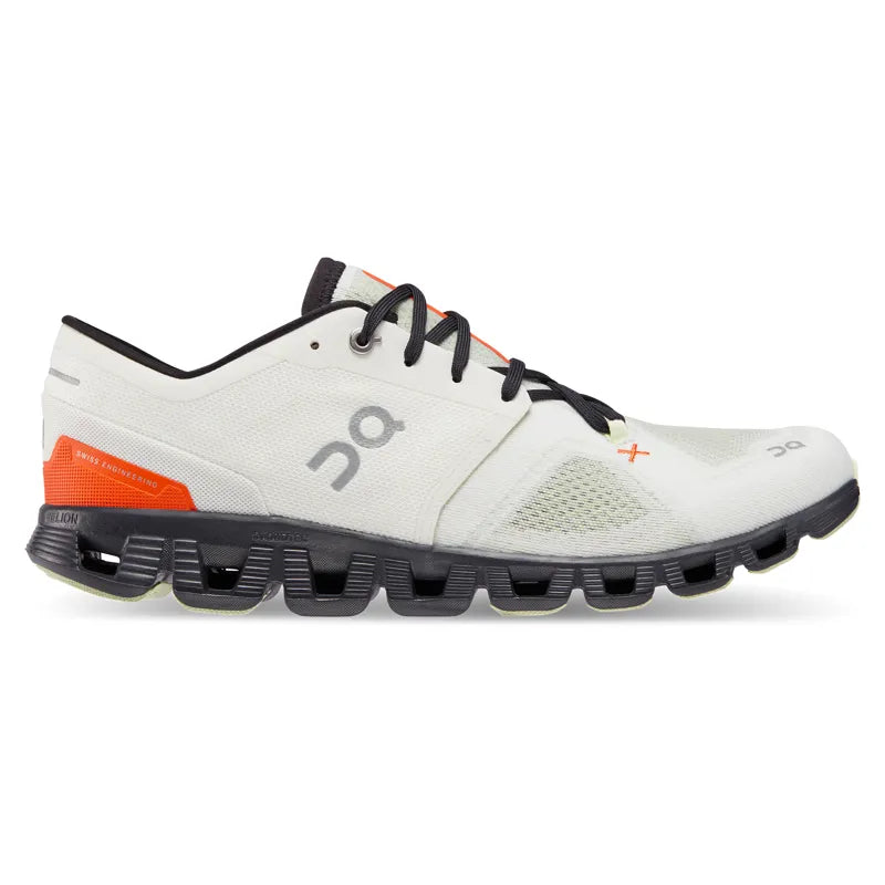 On Cloud X 3 running shoe in ivory white with orange flame accents