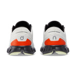 On Cloud X 3 running shoes in ivory and flame orange colorway, rear view