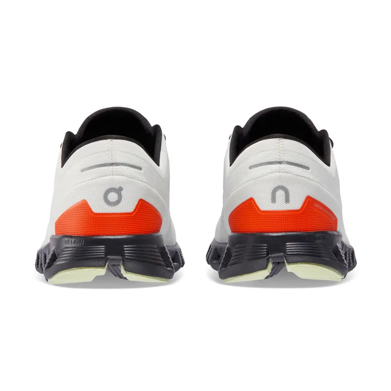 On Cloud X 3 running shoes in ivory and flame orange colorway, rear view