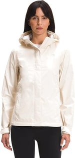Woman wearing cream colored North Face Venture 2 jacket with hood