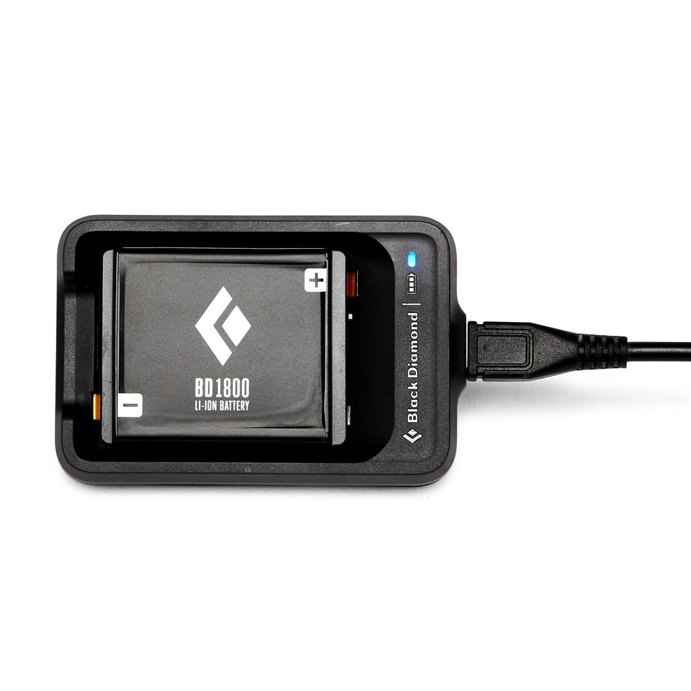 Black Diamond BD1800 lithium battery in black charging dock with USB cable