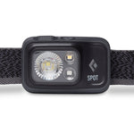 Black Diamond Spot headlamp with LED lights and fabric headband on white background