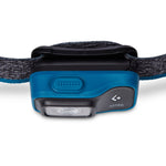 Black Diamond Astro headlamp in blue with black strap on white background