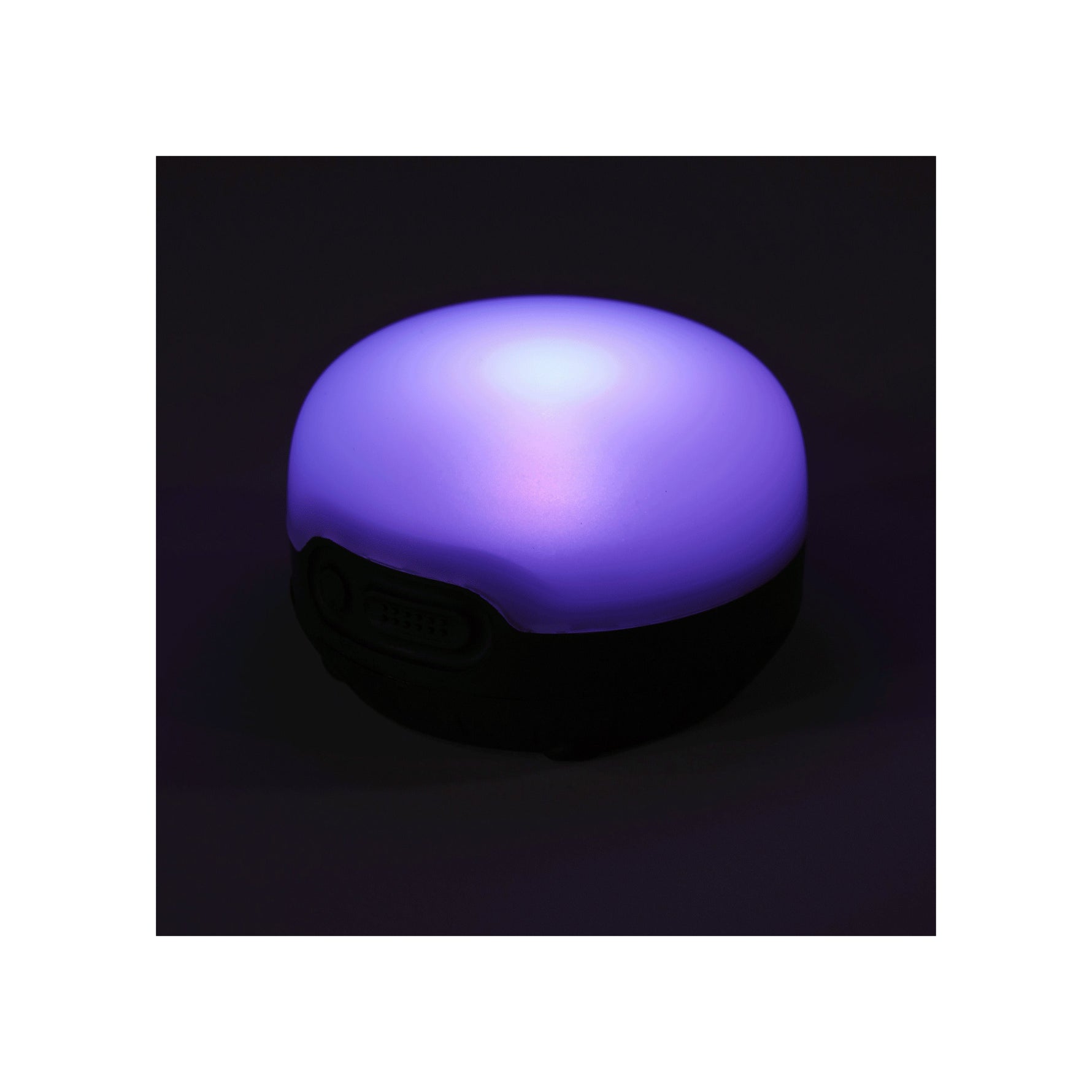 Black Diamond Moji R+ Lantern in black with purple LED light illuminated