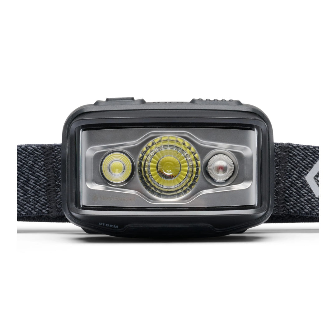Close-up front view of Black Diamond Storm headlamp in black showing three LED lenses