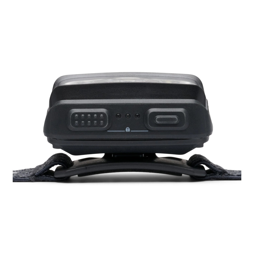 Bottom view of Black Diamond Storm headlamp in black showing USB-C charging port and battery indicators