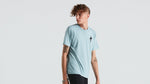 Man wearing light blue Specialized t-shirt with small logo on chest