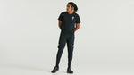 Man wearing dark green Specialized t-shirt and matching athletic pants with logo
