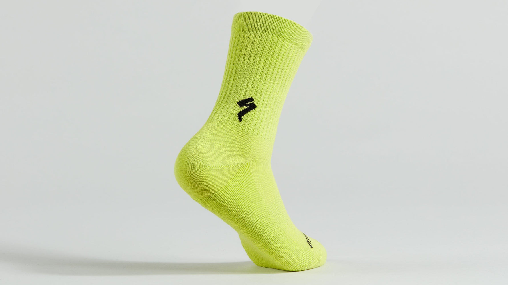Specialized bright yellow tall cycling sock with black logo on clean studio background