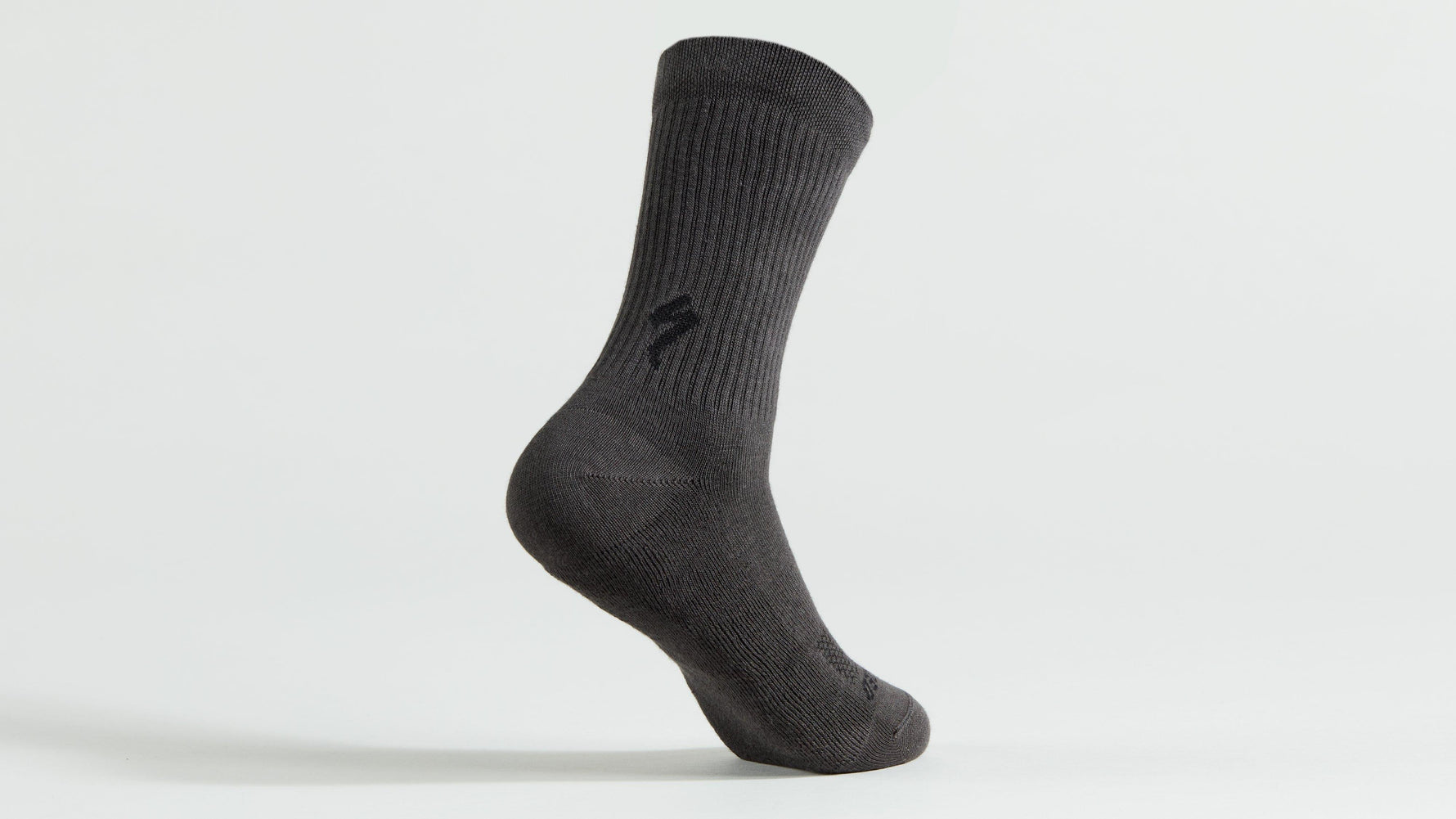 Dark gray ribbed tall cycling sock with subtle logo branding