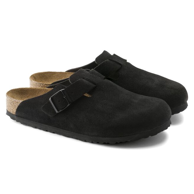 Black Birkenstock Boston clogs with adjustable buckle strap and cork footbed