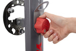 Hand operating red locking mechanism on Yakima SpareRide hitch rack