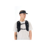 Man wearing black Black Diamond Distance Visor with running vest on white background