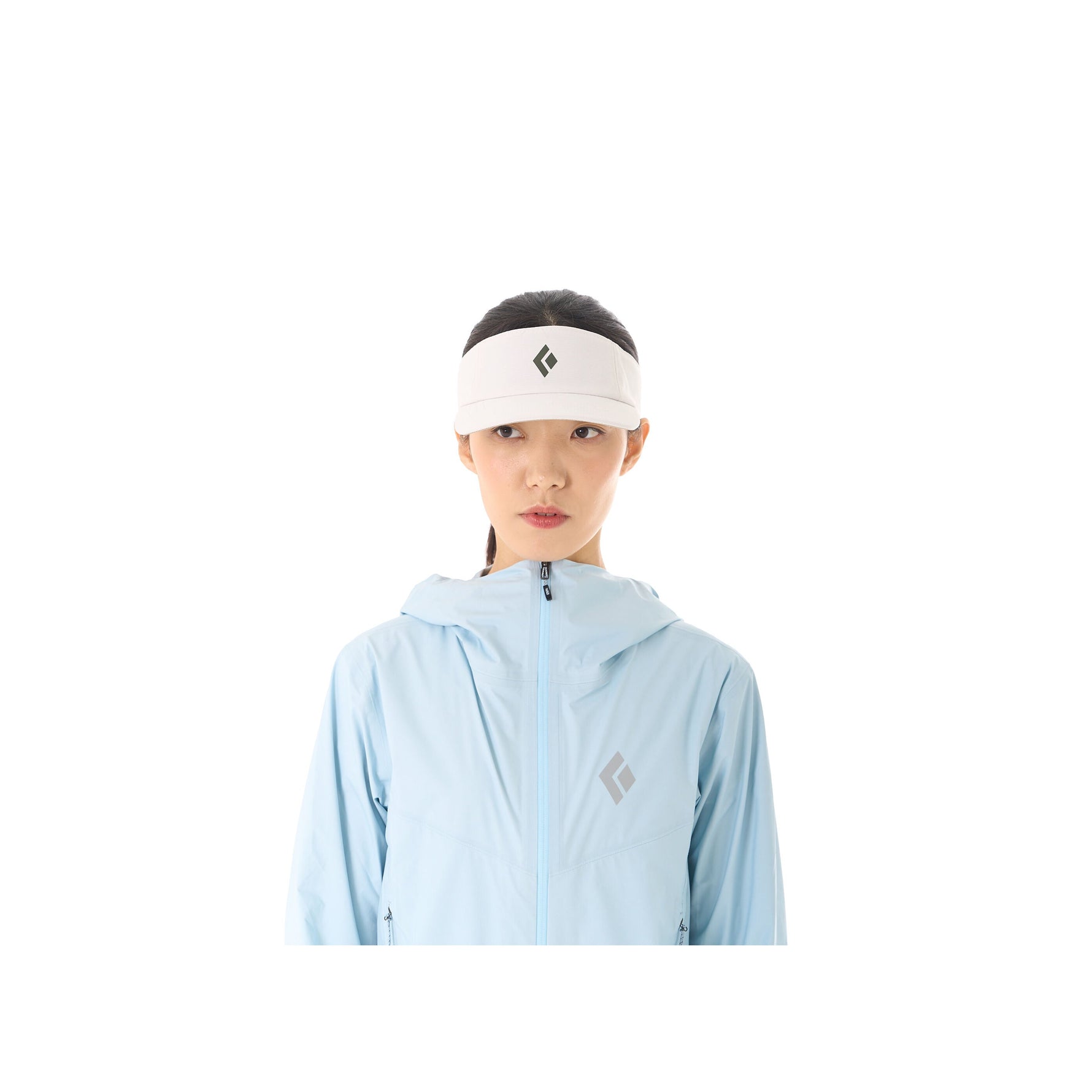 Woman wearing white Black Diamond Distance Visor with diamond logo