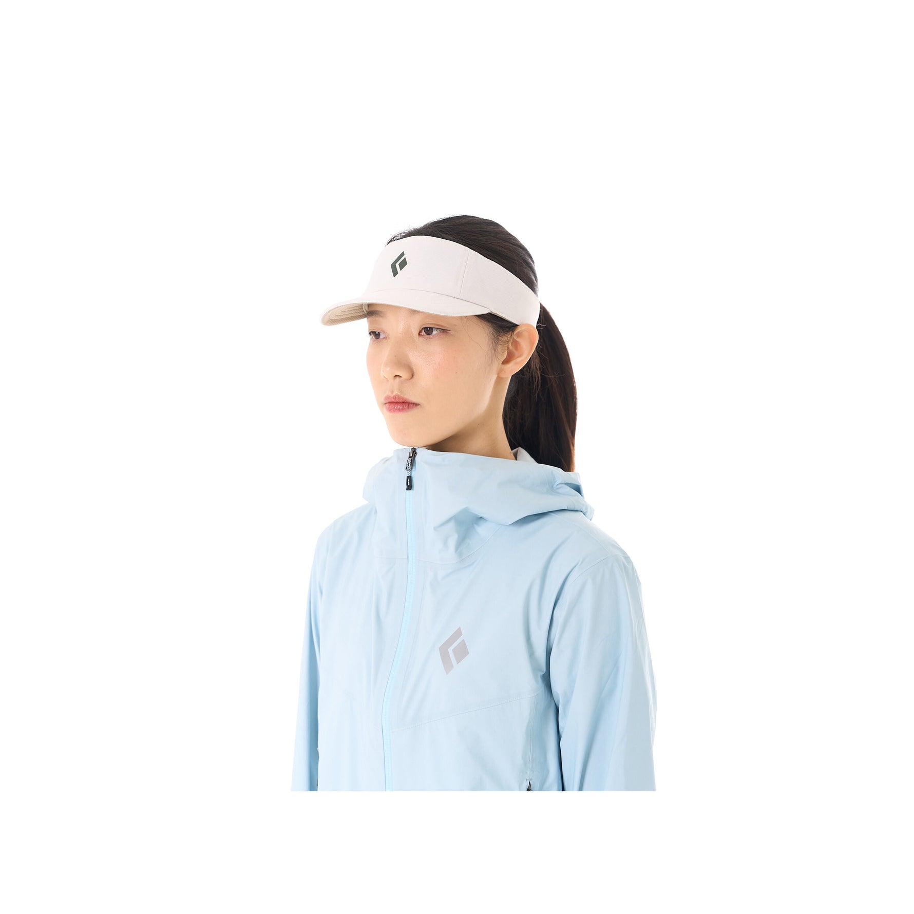 Woman wearing white Black Diamond Distance Visor with light blue athletic jacket